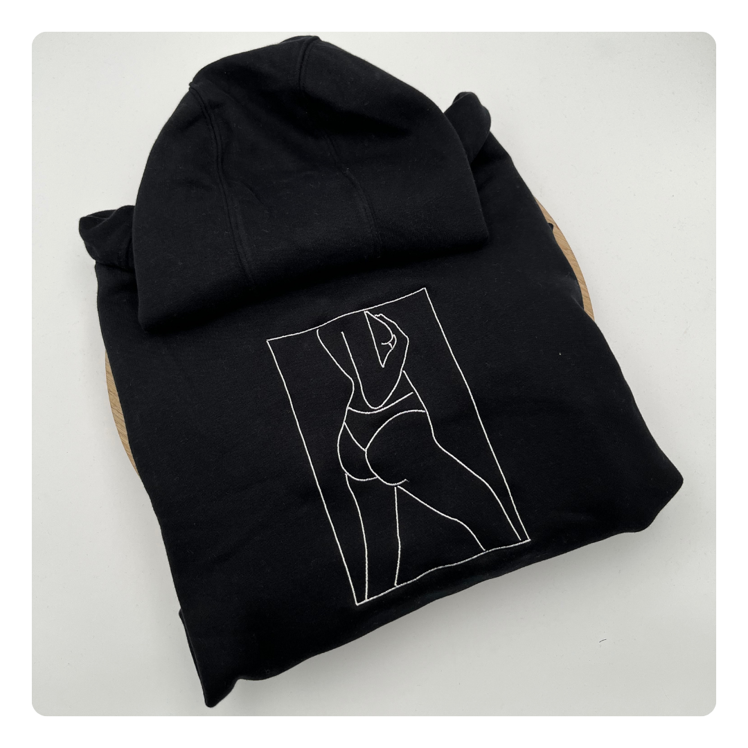 lijntekening van lichaam op sweater geborduurd