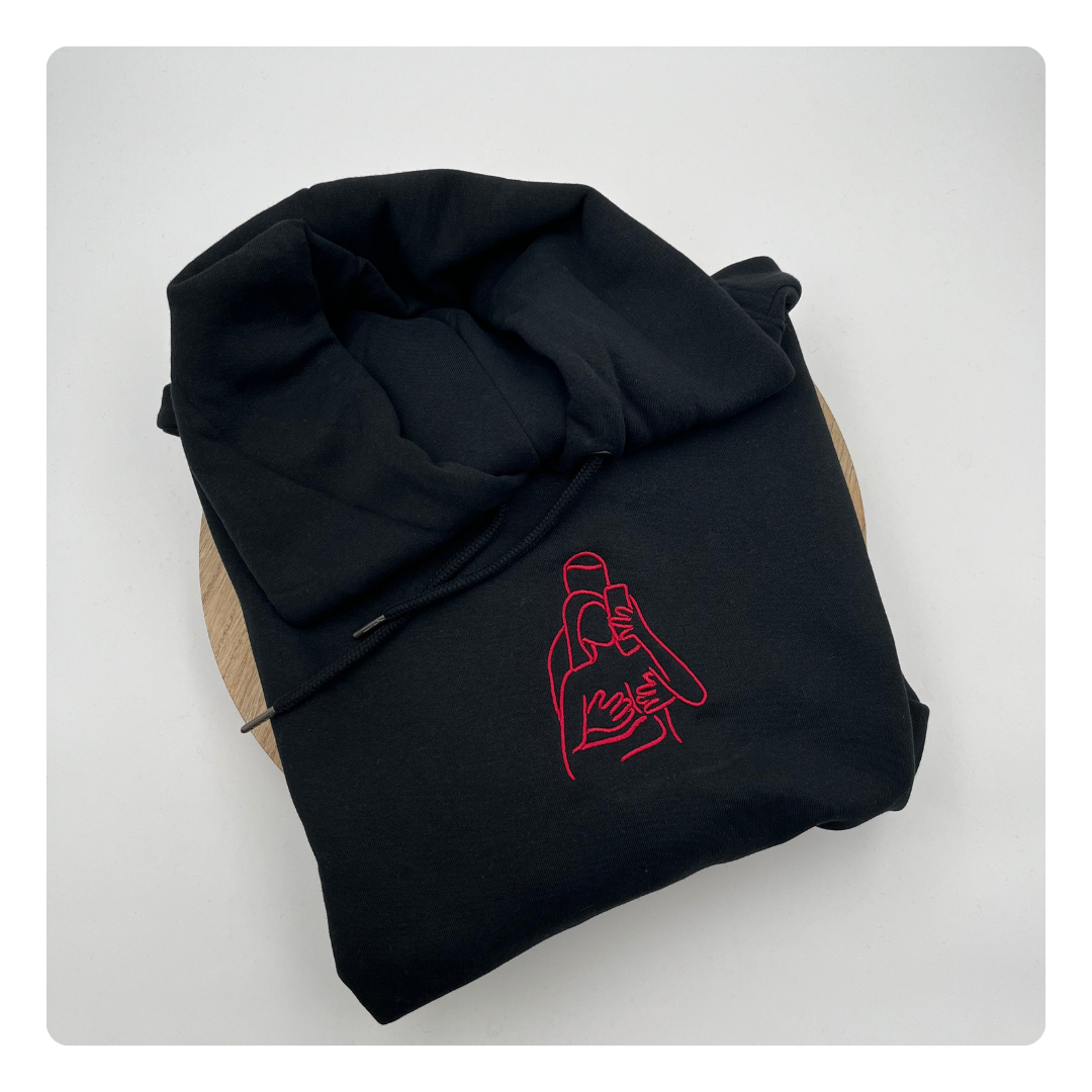 lijntekening van lichaam op sweater geborduurd